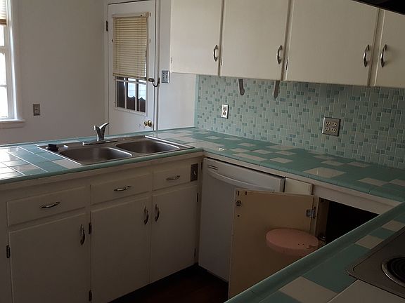 Kitchen with dishwasher and disposal