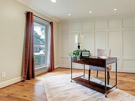 You will find that the home has many custom features as you see the decorative paneling in the flex/study or the chair rail tall baseboards and crown molding in other rooms!