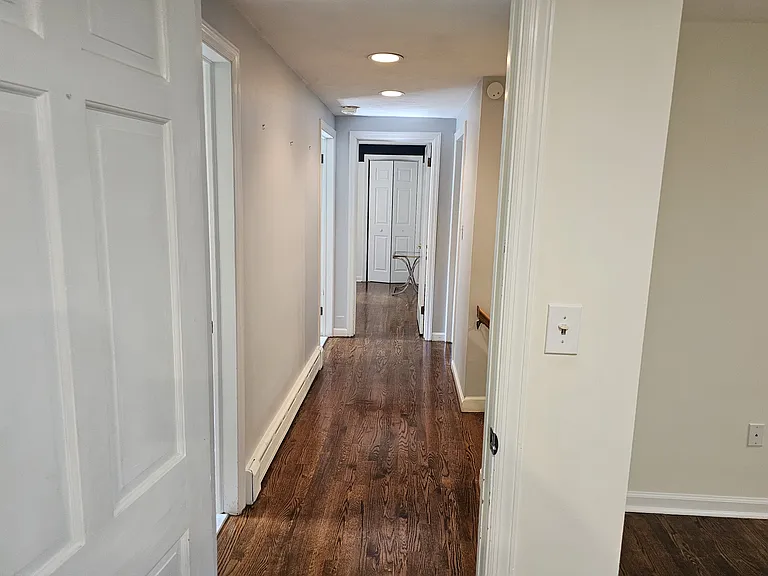 1st floor corridor accessing 1 full bath, 3 bedrooms and 1 laundry room