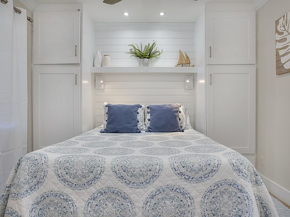 Queen size bed with built in side closets