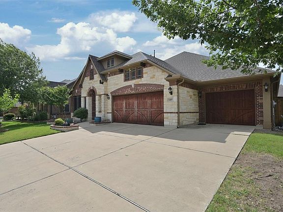 3 Car Garage with storm shelter and storage room