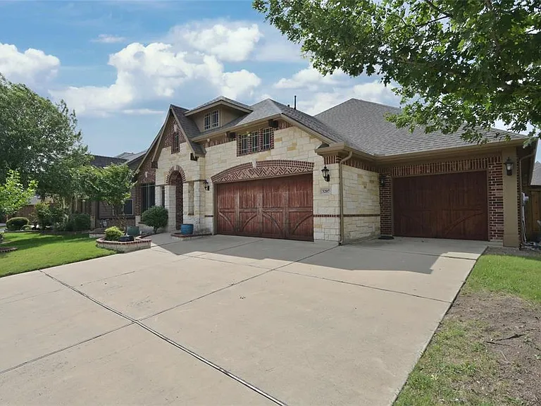 3 Car Garage with storm shelter and storage room