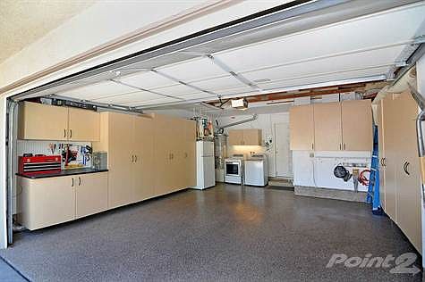 Abundance of closet space in the garage - note the epoxy flooring