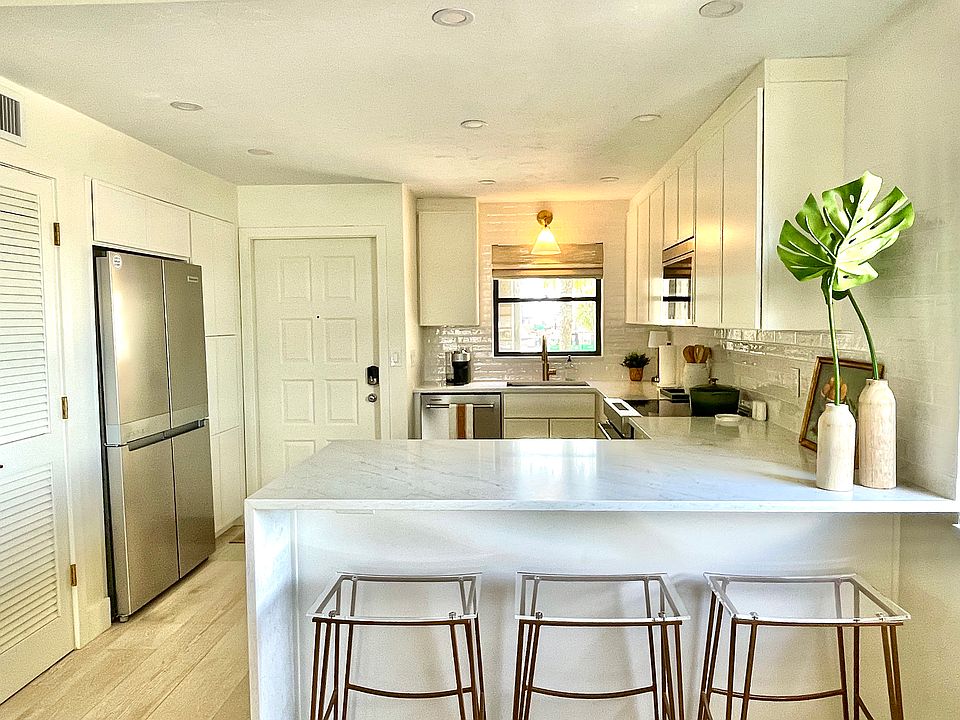 Beautifully designed, functional kitchen with quartz waterfall countertop and Kitchen Aid appliances - and all the cooking tools needed to host dinner for your friends/family