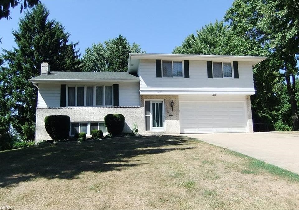 Front view of home on hillside setting.