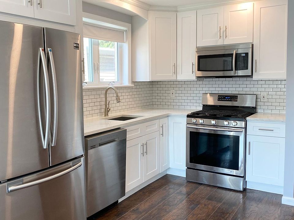 Kitchen with dish washer, microwave. Stainless appliances.