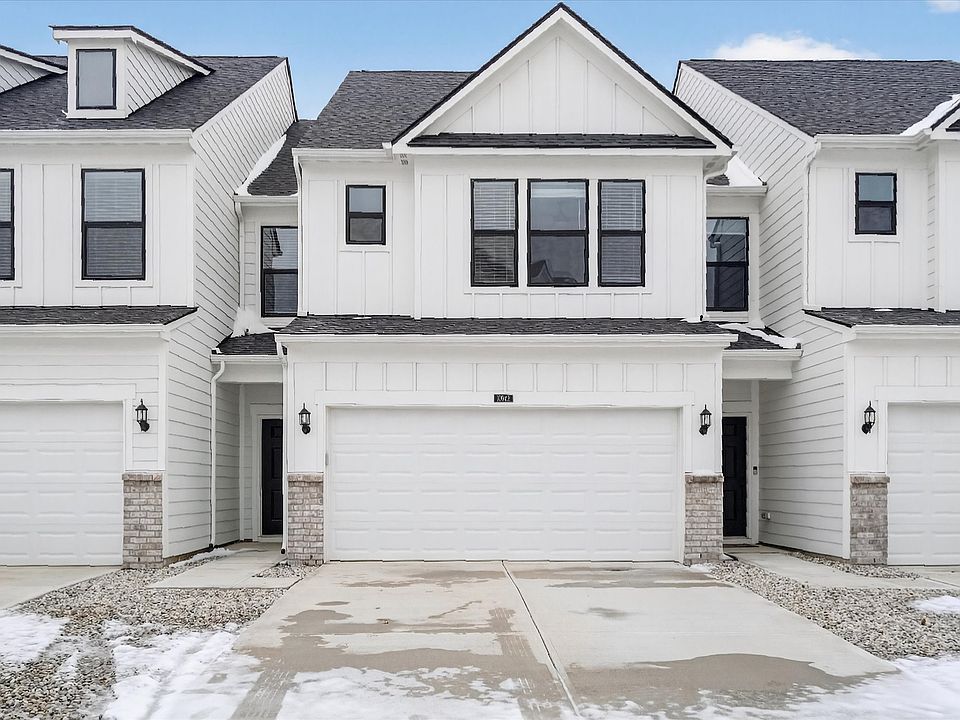 Street view showing 2 car garage with huge driveway for extra parking