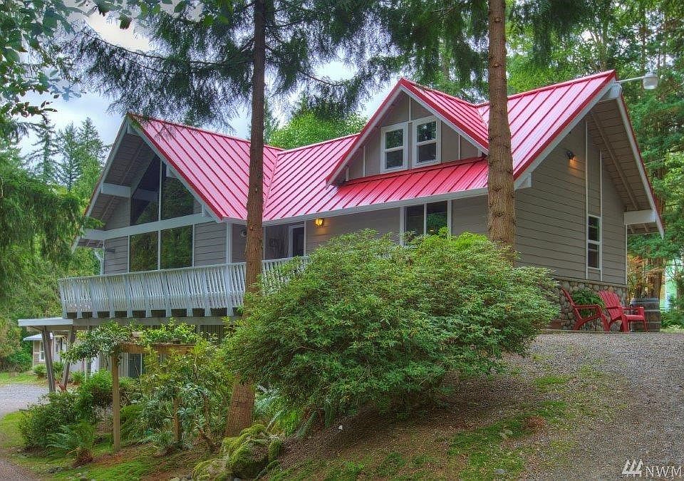 This is the home in the woods everyone is looking for!