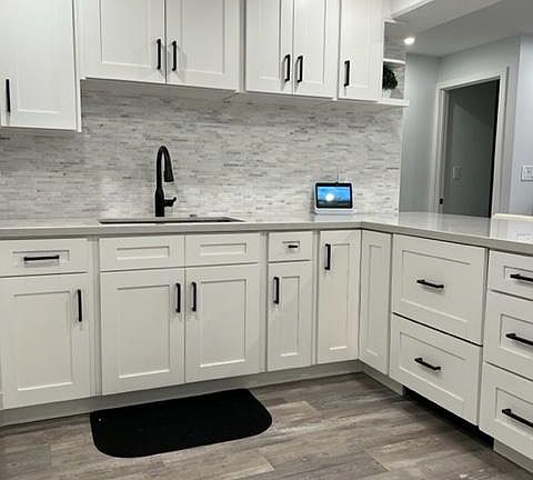 This fully stocked kitchen has lots of plates, dishes, utensils, cookware and all you need to make delicious home cooked meals.