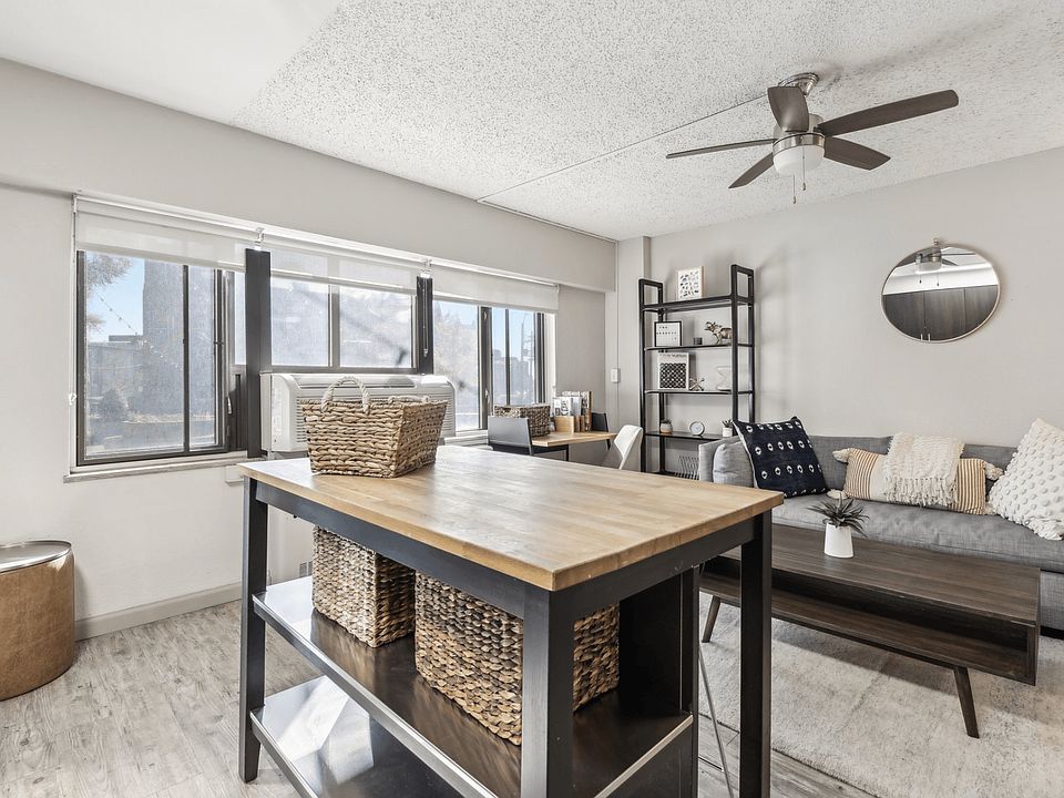 A dining area with extra storage separates the kitchen from the living space