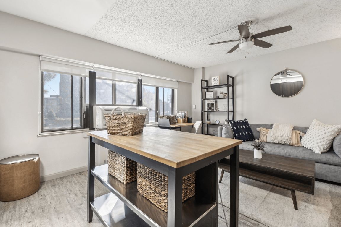A dining area with extra storage separates the kitchen from the living space