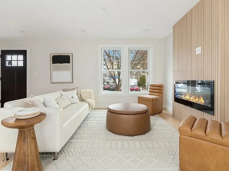 The heart of the home: A sleek, modern fireplace serves as the perfect centerpiece for cozy evenings or relaxing weekends.