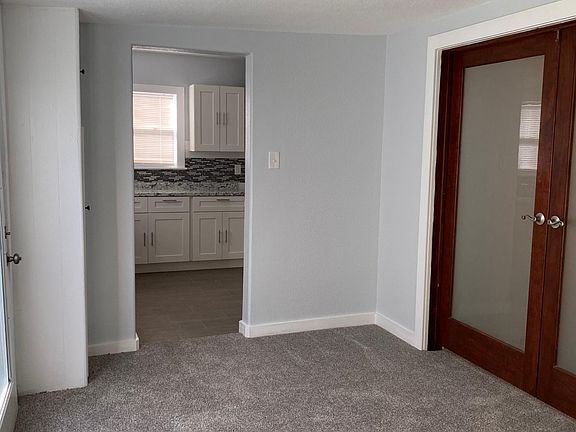 Sunroom with view of backyard