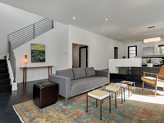 Main floor great room, exceptional light, ten foot ceilings, built-ins, double doors lead into the den/flex room. 