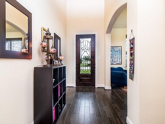 Beautiful 2 story Foyer adorned with hardwood floors that extend into the Formal Dining Room.