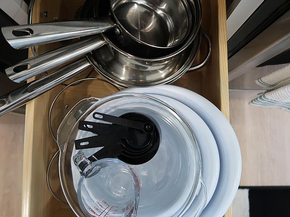 Pots, pans, baking dishes, measuring cups, and mixing bowls are all readily available.