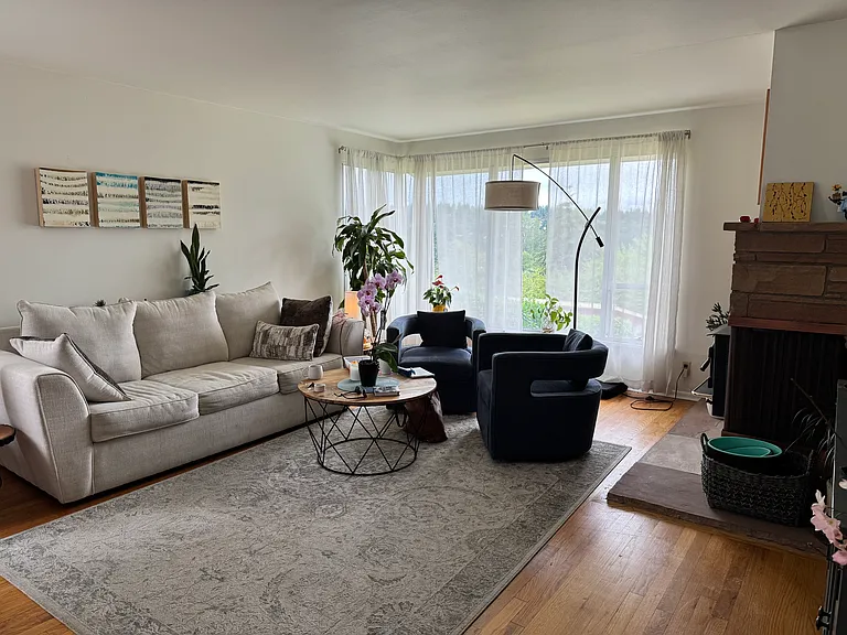 Large living room with hard wood floors, territorial view from windows