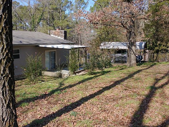 Back yard, covered patio, covered parking spot