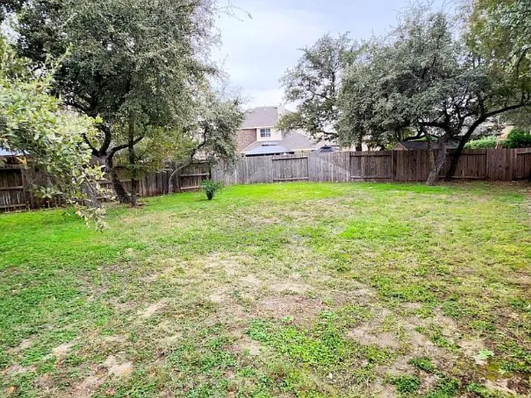 Plenty of room to run. Left side of backyard