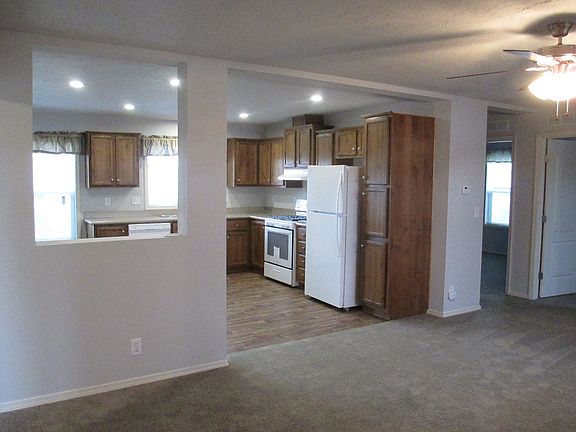 Living room leads to kitchen