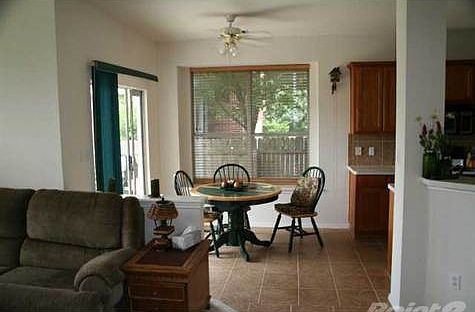 Breakfast nook with breakfast bar. Formal living room on opposite side, tiled as well. Large and sunny spaces both of these. Appliances all stay and washer and dryer.