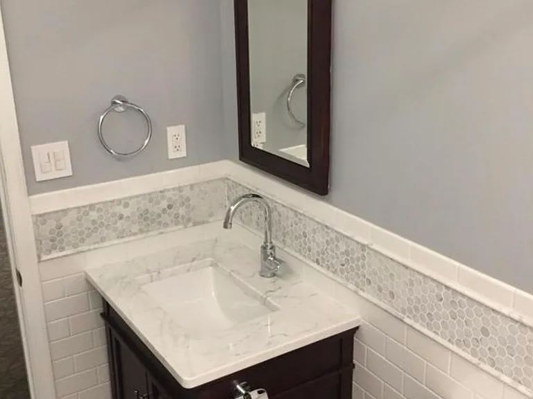 Bathroom 3 downstairs with marble tile