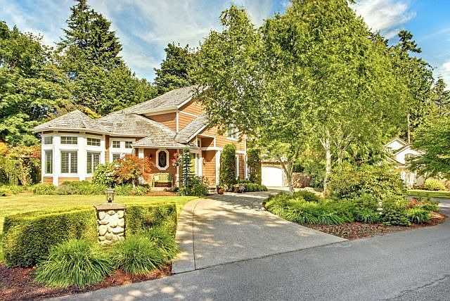 Located on a private lane, and ideally sited on a level lot, the warmth of thi