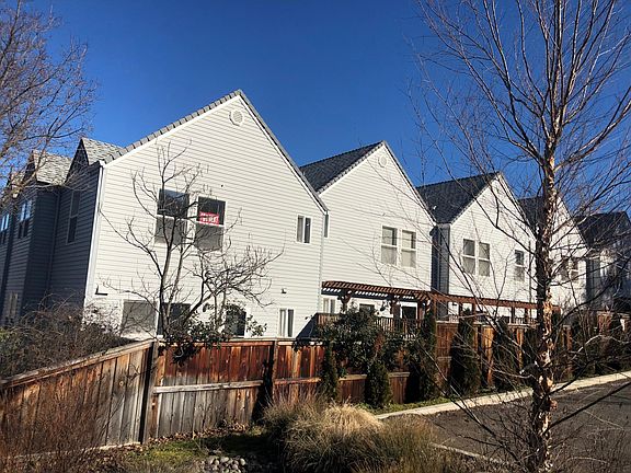 Rear view of the townhouse (left) notice it is larger than the other units.