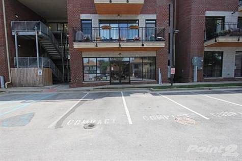 120B is on the first floor, designated  parking spaces, stairway to left is for residents in condo's on 2nd & 3rd floor.
