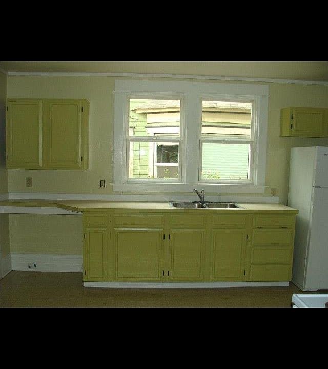 Kitchen opens to private back porch which leads to basement