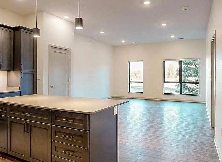 Step into our one-bedroom, first-floor Elk apartment, beautifully designed with rich, dark cabinetry and thoughtful finishes that elevate your living experience.