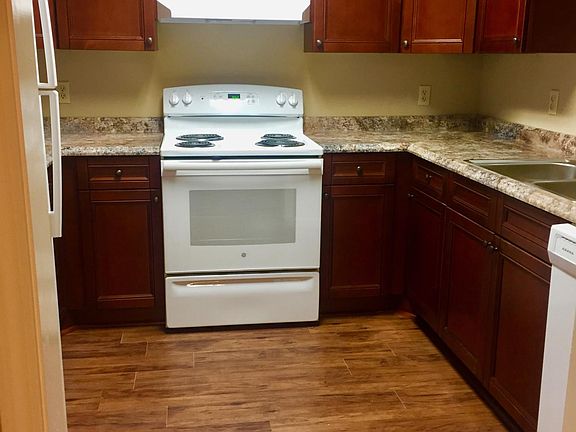 Kitchen with fridge, stove, and dishwasher