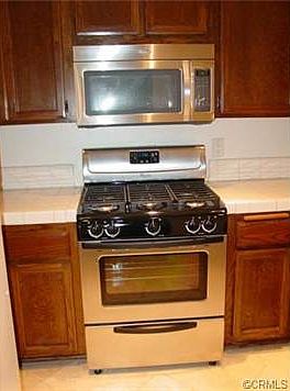 New Stainless steel gas stove, microwave oven and dishwasher.