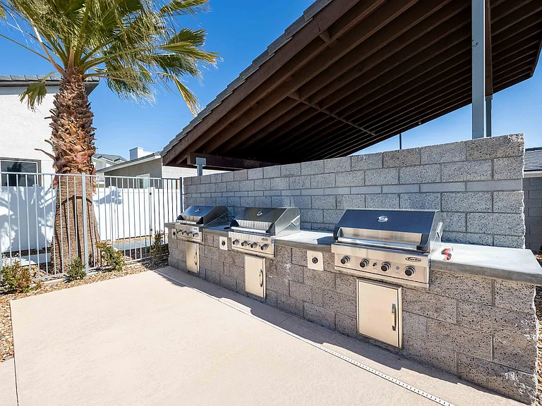 Experience outdoor cooking at its finest with our modern grilling area, complete with multiple BBQ stations.