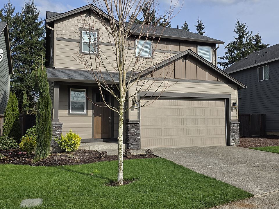 two car garage with opener, beautiful landscaping