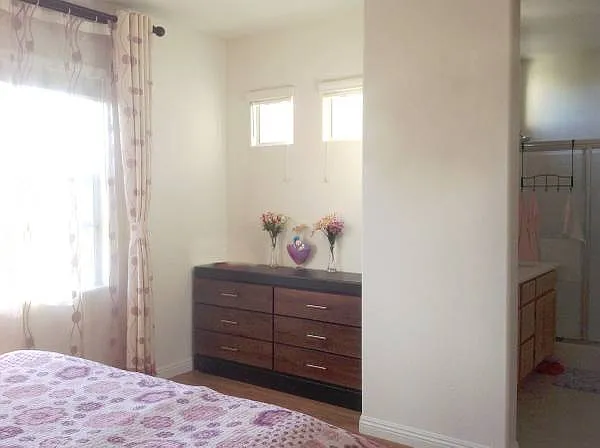 Another view of the primary bedroom, showing the adjoining bathroom