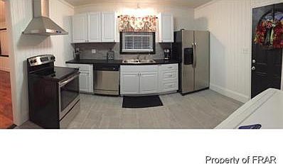 Kitchen with combo washer dryer available, all stainless app