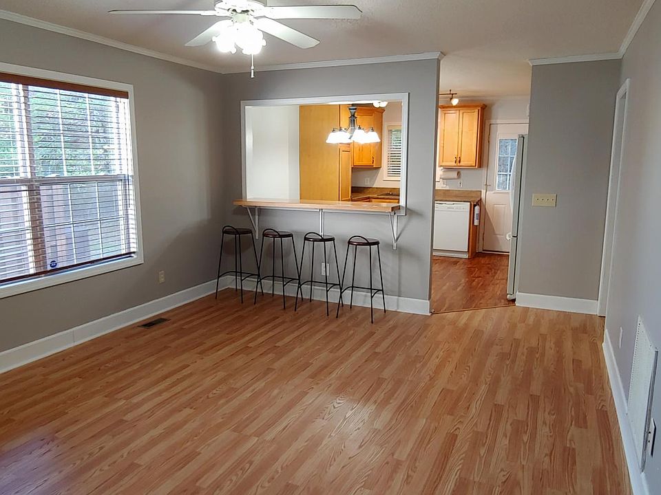 Living room view looking toward kitchen and bar.