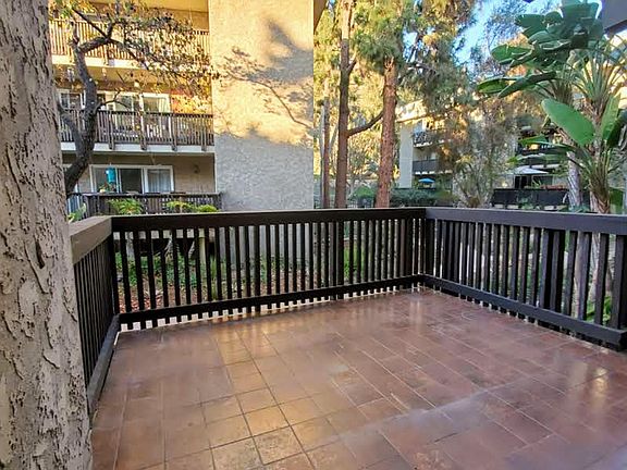Large patio in a green, peaceful setting.
