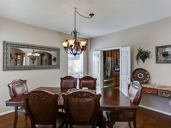 The formal dining is so inviting as the first room upon entry to the home. The hardwood floors and updated light fixtures accent this beautiful space. What a grand entry space.