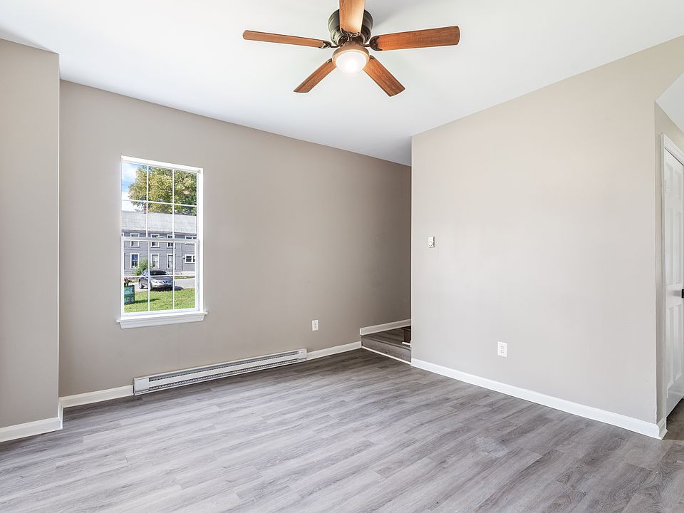 Dinning room or additional living room, entry way to bottom of stairs on the left and to the right, entry way to the kitchen