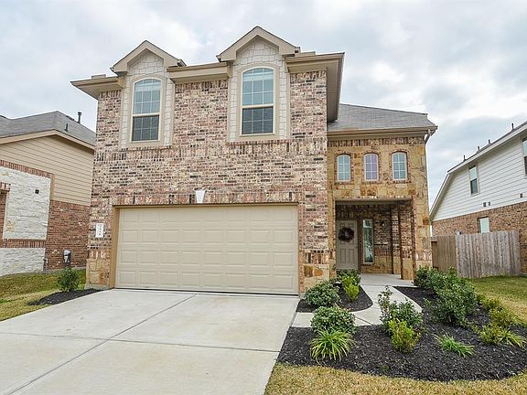 Upgraded brick and stone elevation with front porch, in highly sought after Camillo Lakes!