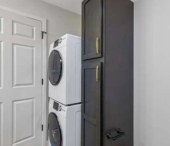 Smartly designed laundry space with sleek built-in storage that keeps everyday routines effortlessly organized.