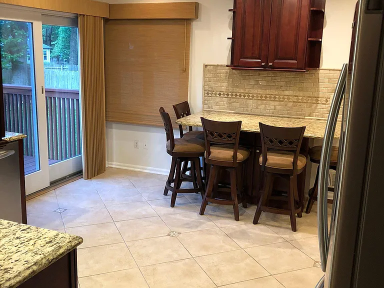 Open kitchen layout with custom cabinetry and abundant workspace.