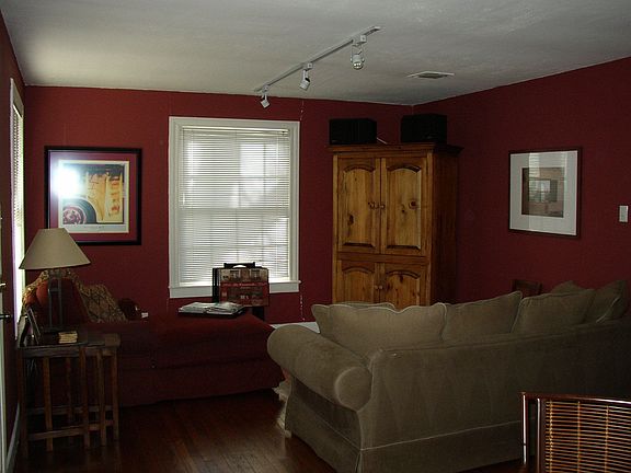 living area with rich red colors