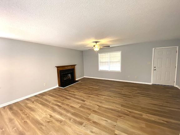 Front door opens to a wide open floor plan. There is a gas log fireplace.