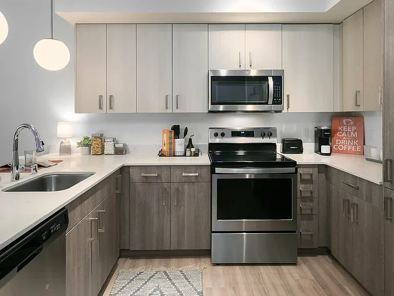 Kitchen with Stainless Steel Appliances and Quartz Countertops