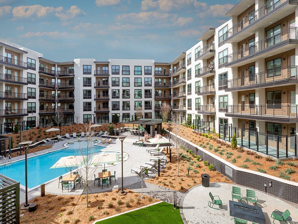 Resort-style Swimming Pool with Tanning Ledge Cabanas and Sundeck