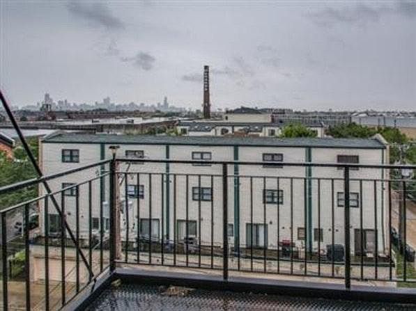 Balcony with view of city skyline