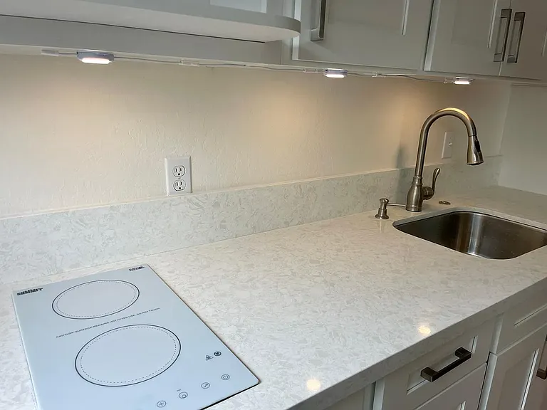 New kitchen cabinets, quartz countertop, new appliances